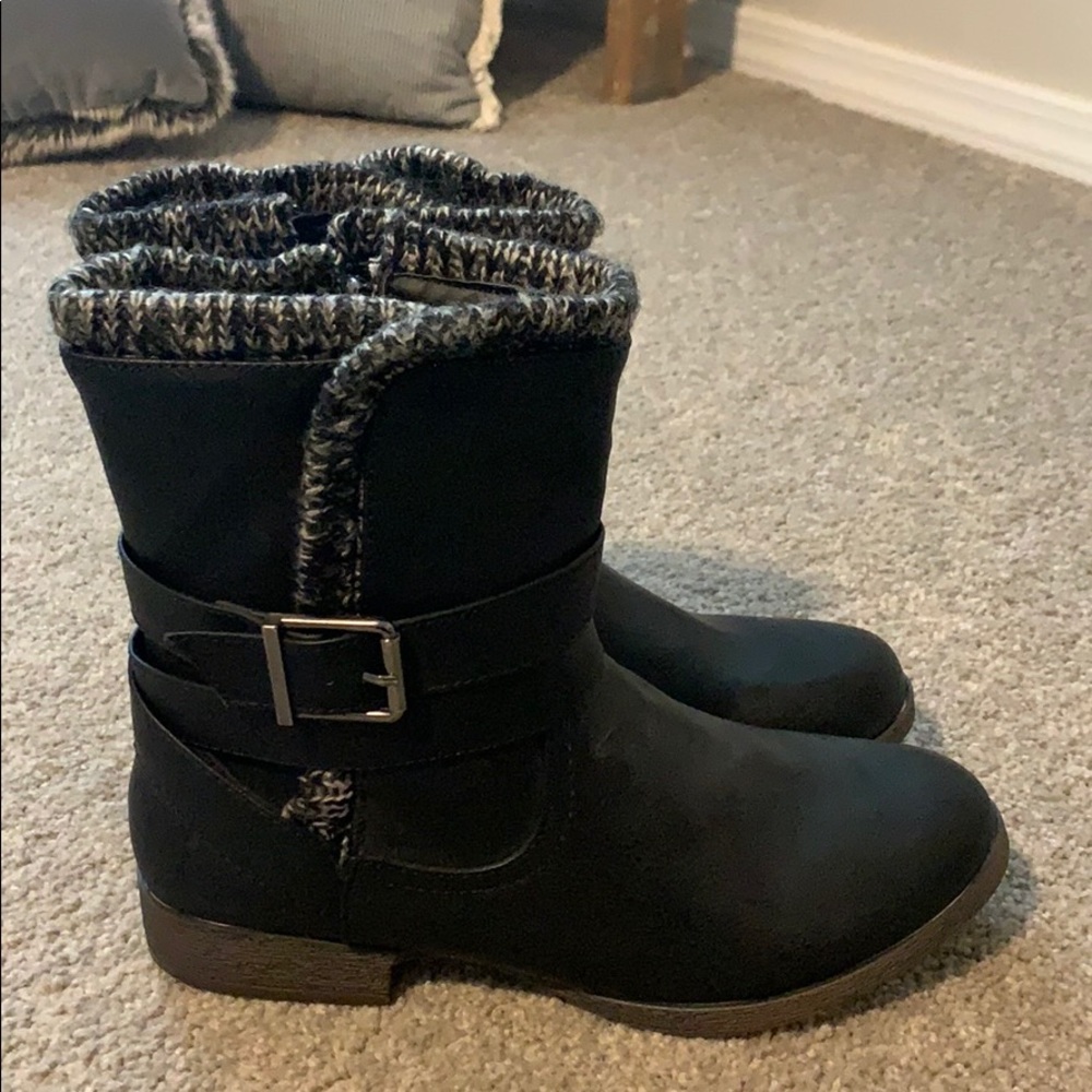 Black boots with buckle detail